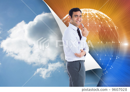 Composite image of smiling businessman holding glasses 9607028