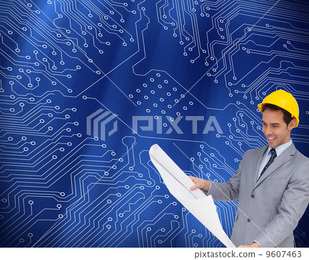 Composite image of smiling architect with hard hat looking at pl 9607463
