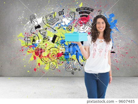 Composite image of content casual brunette holding a present Composite image of content casual brunette holding a present 9607485