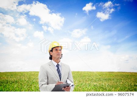 Composite image of architect taking notes Composite image of architect taking notes 9607574