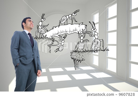Composite image of smiling businessman standing Composite image of smiling businessman standing 9607828