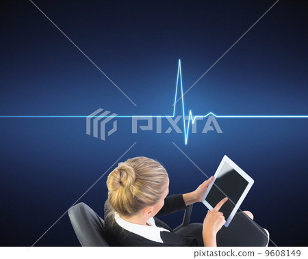 Composite image of businesswoman sitting on swivel chair with ta 9608149