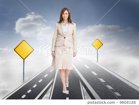 Composite image of smiling businesswoman walking 9608188