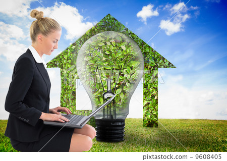 Composite image of businesswoman using laptop Composite image of businesswoman using laptop 9608405