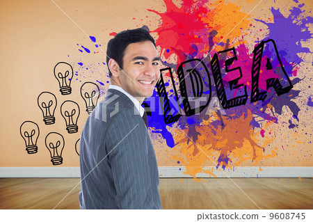 Composite image of smiling businessman standing 9608745