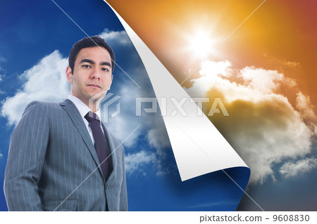 Composite image of unsmiling businessman standing 9608830