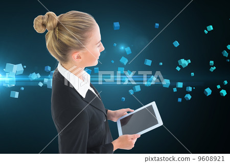Composite image of businesswoman holding tablet 9608921