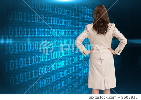 Composite image of businesswoman standing back to camera 9608935