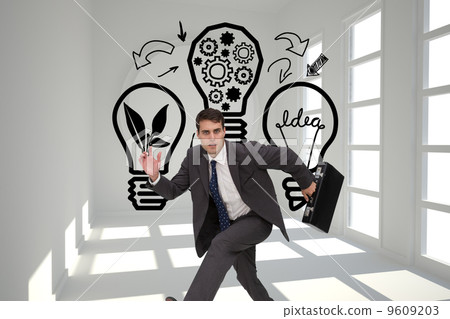 Composite image of stern businessman in a hury Composite image of stern businessman in a hury 9609203