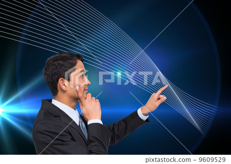 Composite image of thoughtful asian businessman pointing Composite image of thoughtful asian businessman pointing 9609529