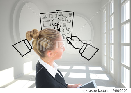 Composite image of businesswoman holding tablet 9609601