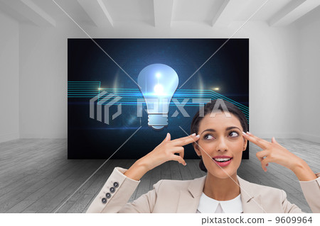 Composite image of confident young businesswoman pointing her he Composite image of confident young businesswoman pointing her he 9609964