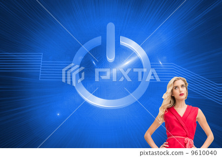 Composite image of elegant blonde standing hands on hips 9610040