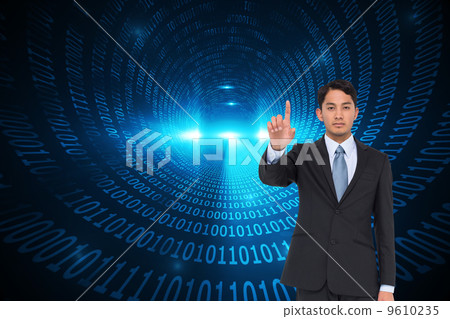 Composite image of serious asian businessman pointing Composite image of serious asian businessman pointing 9610235