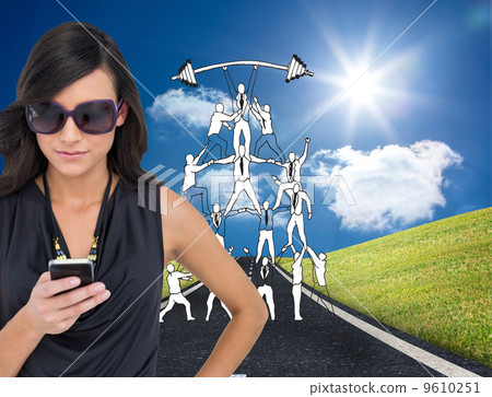 Composite image of happy brunette using smartphone Composite image of happy brunette using smartphone 9610251