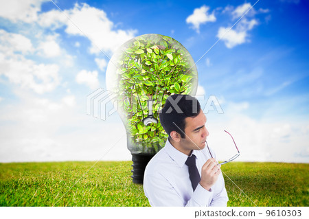 Composite image of unsmiling businessman holding glasses Composite image of unsmiling businessman holding glasses 9610303