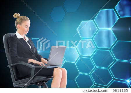 Composite image of businesswoman sitting on swivel chair with la 9611165