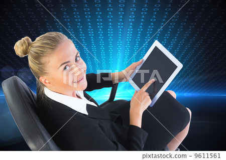 Composite image of businesswoman sitting on swivel chair with ta 9611561