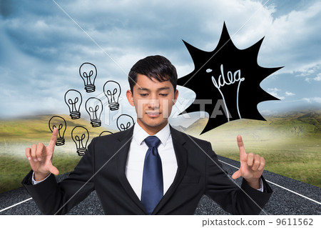 Composite image of unsmiling businessman holding Composite image of unsmiling businessman holding 9611562