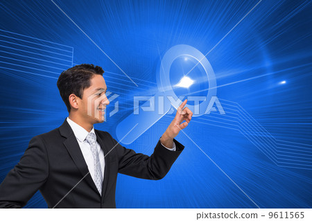 Composite image of smiling asian businessman pointing Composite image of smiling asian businessman pointing 9611565