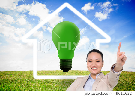 Composite image of smiling asian businesswoman pointing Composite image of smiling asian businesswoman pointing 9611622