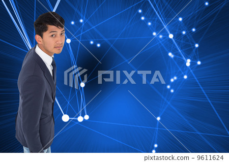 Composite image of unsmiling casual businessman walking Composite image of unsmiling casual businessman walking 9611624