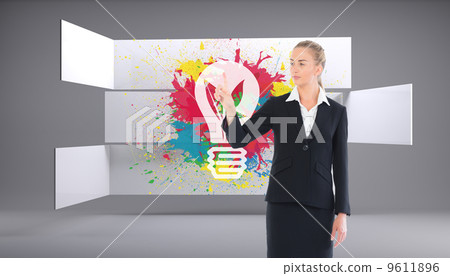 Composite image of young blonde business woman pointing Composite image of young blonde business woman pointing 9611896