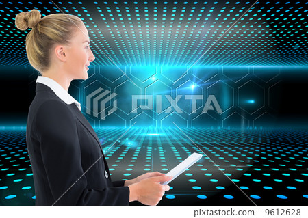 Composite image of businesswoman holding tablet Composite image of businesswoman holding tablet 9612628