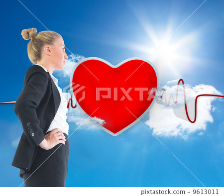 Composite image of businesswoman standing with hands on hips Composite image of businesswoman standing with hands on hips 9613011