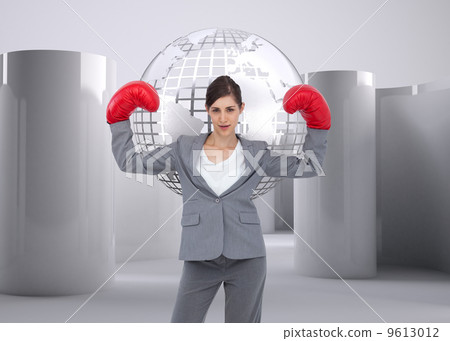 Composite image of businesswoman with boxing gloves 9613012