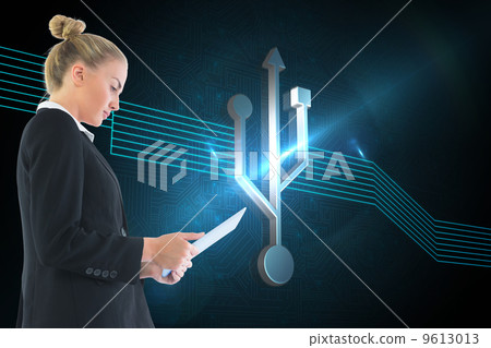 Composite image of businesswoman holding tablet 9613013