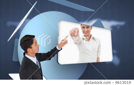 Composite image of stern asian businessman pointing Composite image of stern asian businessman pointing 9613019