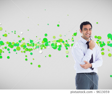 Composite image of smiling businessman holding glasses Composite image of smiling businessman holding glasses 9613059