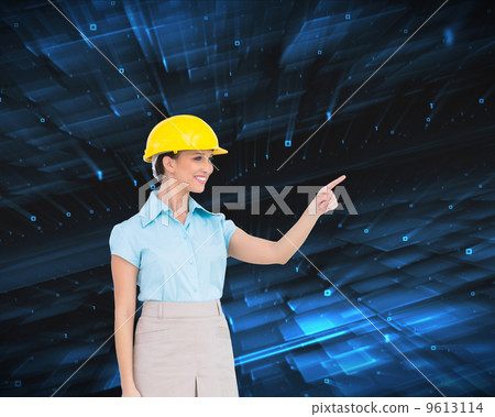 Composite image of smiling attractive architect pointing 9613114