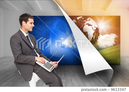 Composite image of businessman using laptop 9613397