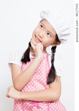 Little Asian cute chef wearing pink apron thinking action Little Asian cute chef wearing pink apron thinking action 9617343