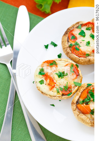 Mushrooms stuffed with mozzarella and tomato Mushrooms stuffed with mozzarella and tomato 9617620