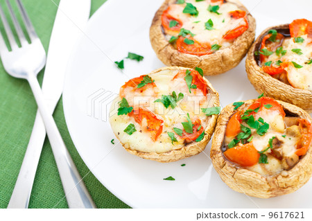 Mushrooms stuffed with mozzarella and tomato Mushrooms stuffed with mozzarella and tomato 9617621