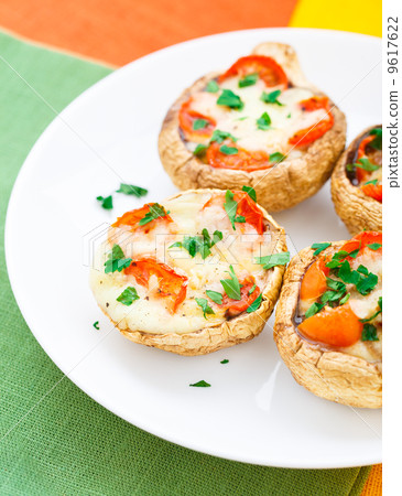 Mushrooms stuffed with mozzarella and tomato Mushrooms stuffed with mozzarella and tomato 9617622