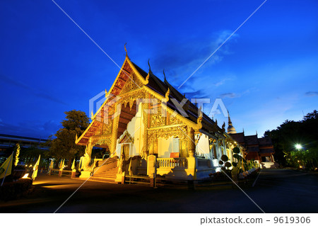 Wat Phra Singh temple at sunset in Chiang Mai, Thailand. 9619306