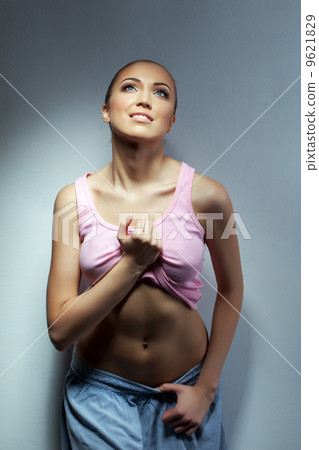 Portrait of smiling pretty girl posing in studio Portrait of smiling pretty girl posing in studio 9621829