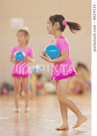 Girls practicing rhythmic gymnastics 9624534