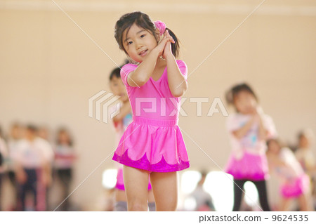 Girls practicing rhythmic gymnastics 9624535