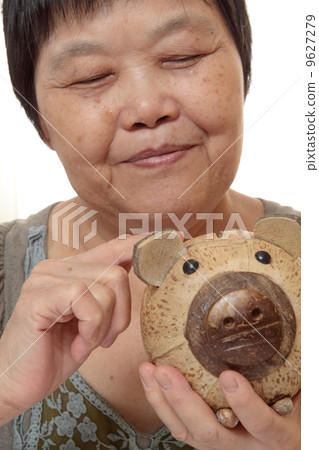 woman putting coins in small piggy bank. Selective focus, Copy s woman putting coins in small piggy bank. Selective focus, Copy s 9627279