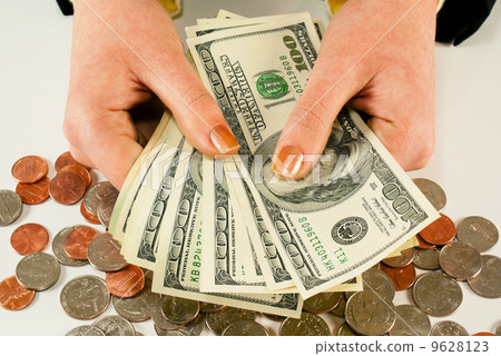 Female's hands with 100 US dollar bills Female's hands with 100 US dollar bills 9628123