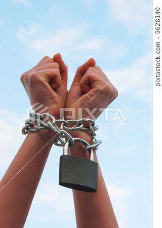 Hands tied up with chains 9628140