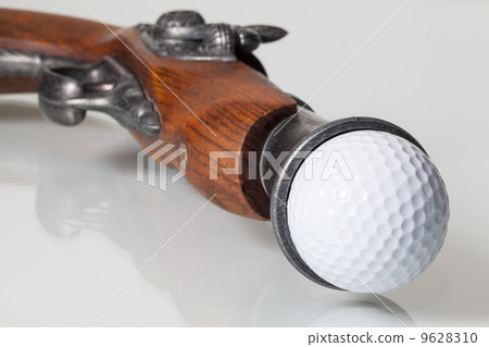 Old gun and golf ball 9628310