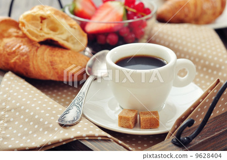 Cup of coffee with croissants 9628404