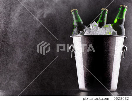 Beer bottles in ice bucket 9628682