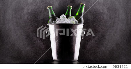 Beer bottles in ice bucket Beer bottles in ice bucket 9631221